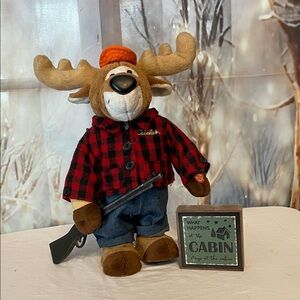 Singing Moose Plush wRifle  & Cabin Sign. A great gift for your favorite hunter.